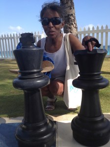 Mom with giant chess pieces.