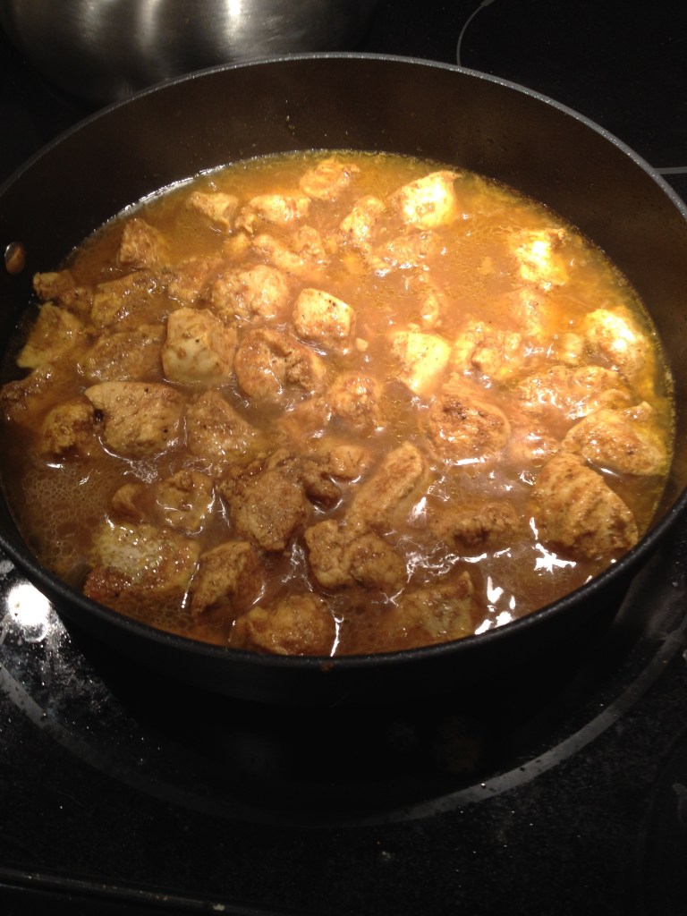 curry chicken cooking on stove