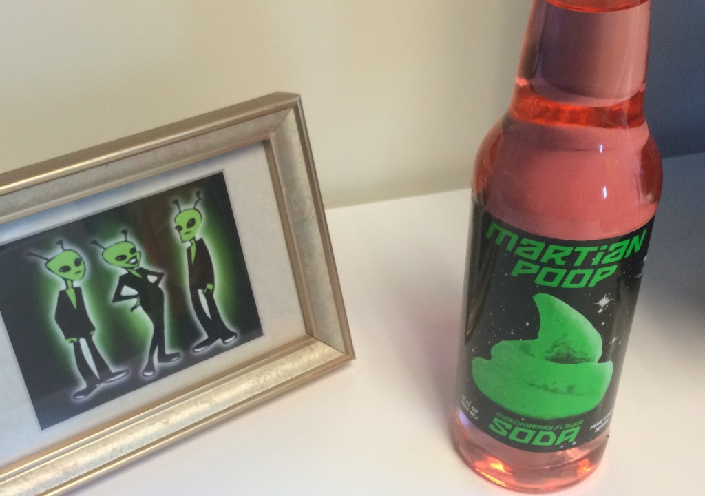 Alien family from Mars in photo next to Martian Poop soda