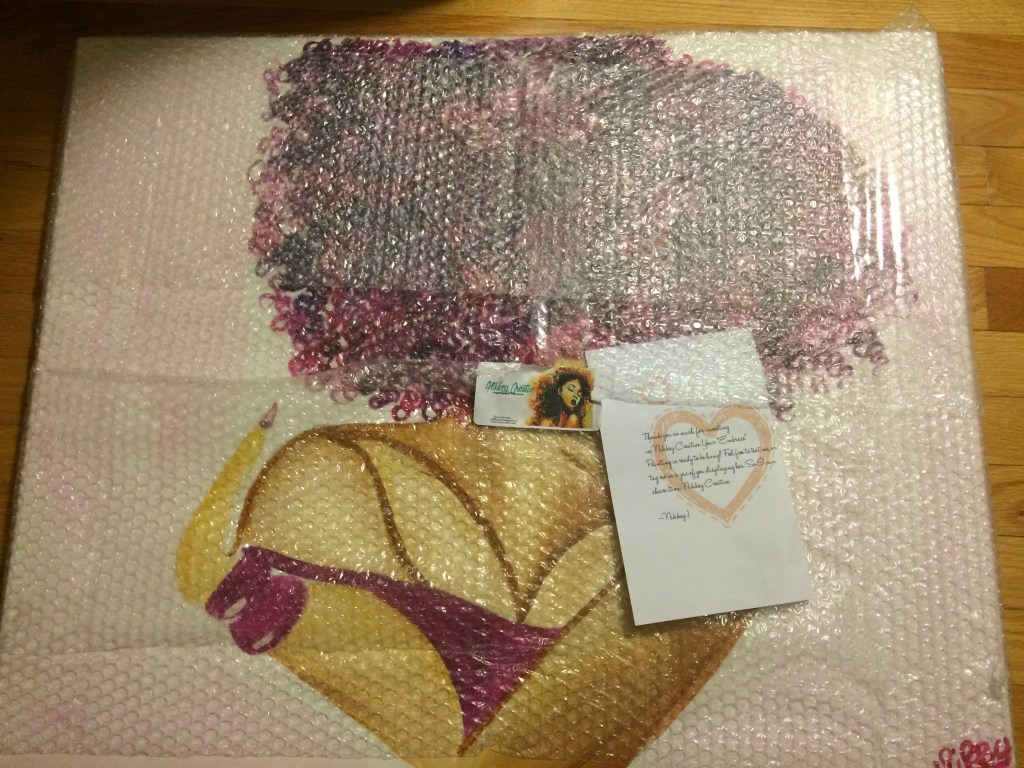 curly afro woman hugging herself