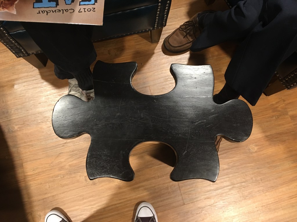 table shaped like a jigsaw puzzle piece