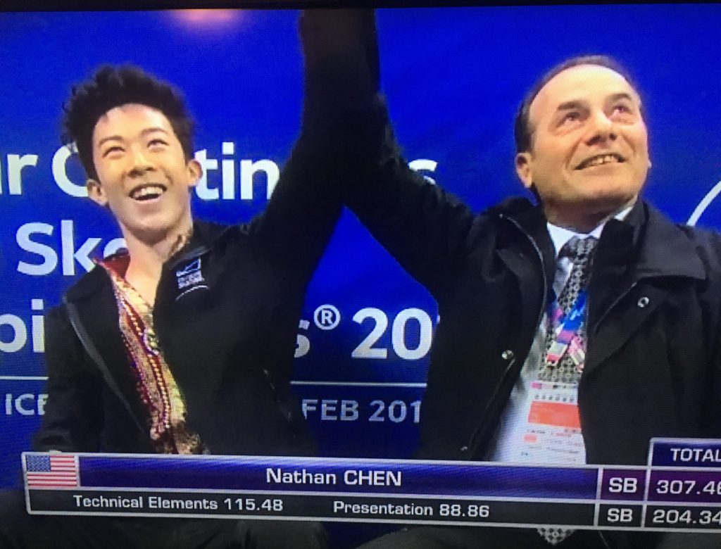 Nathan Chen sitting in kiss and cry area