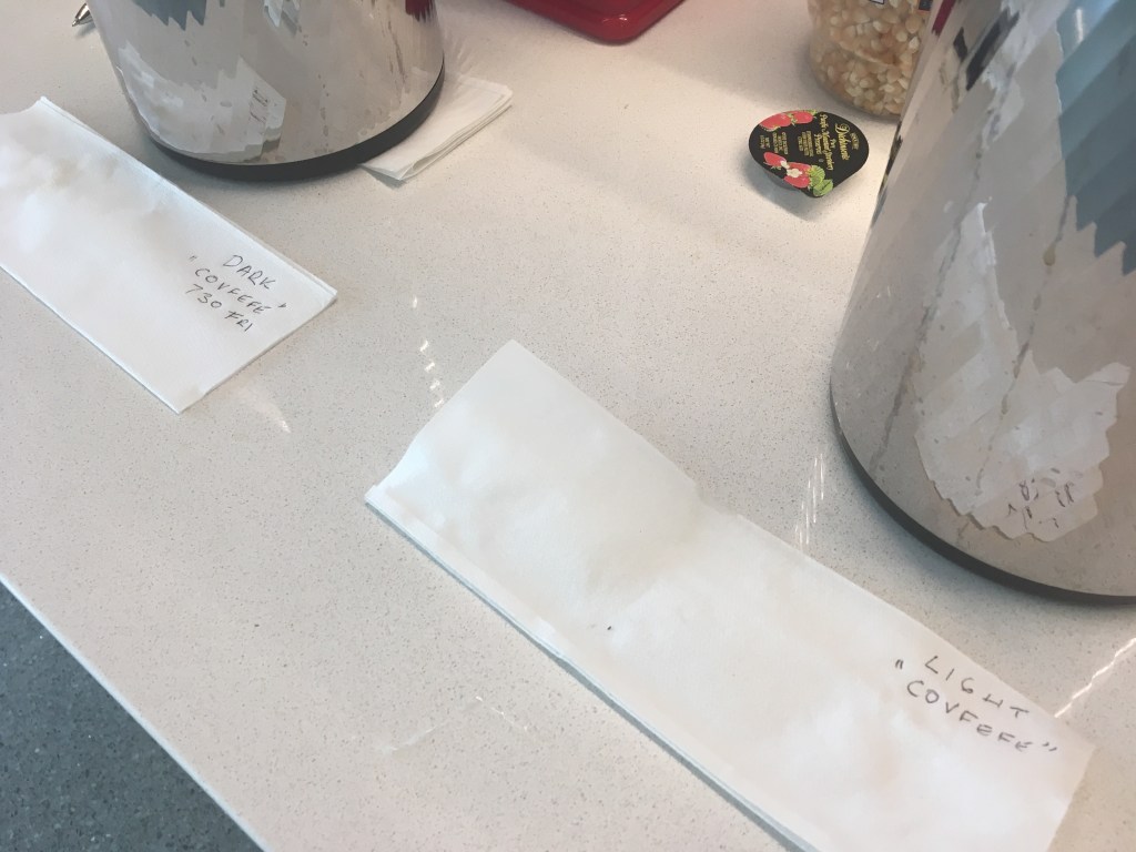 dark covfefe and light covfefe labels by coffee pots