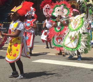 Parade participants dressed similar to cards