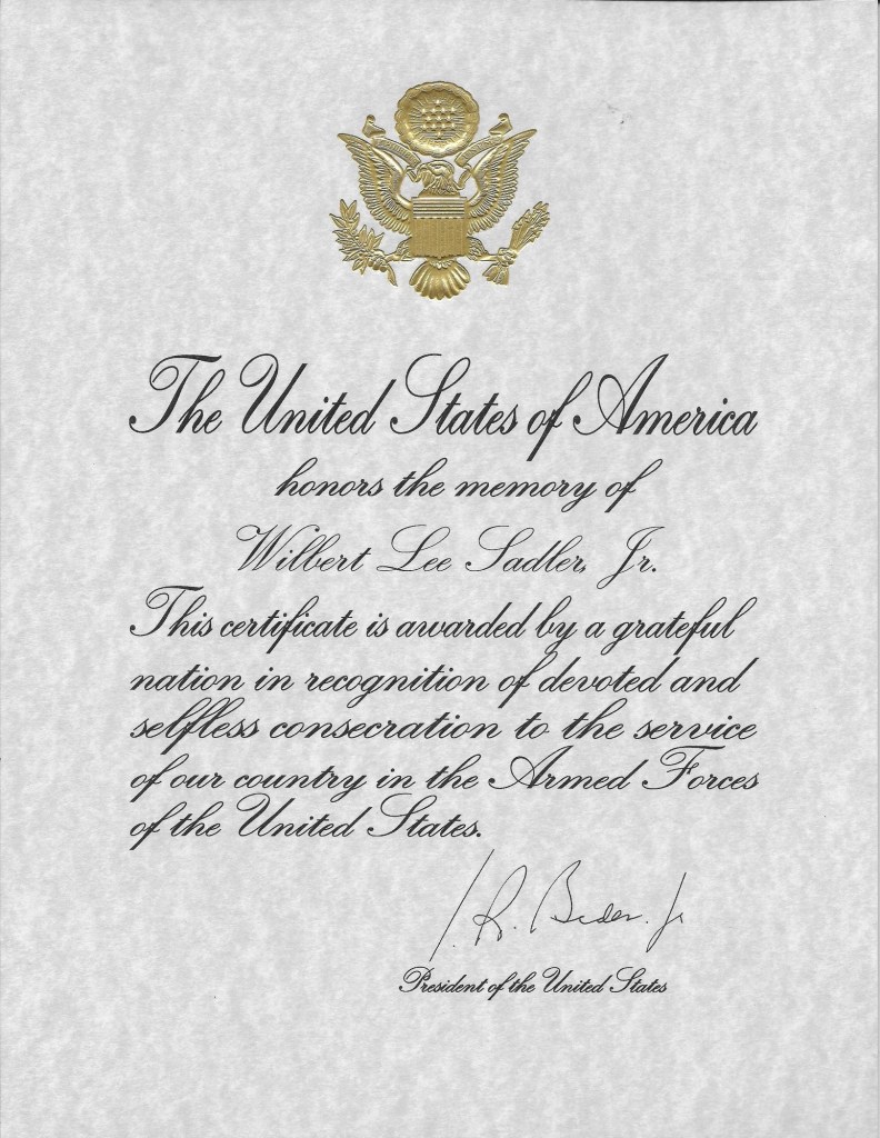 Letter from U.S. President Joseph R. Biden Jr. reading The United States of America honors the memory of Wilbert Sadler Jr. This certificate is awarded by a grateful nation in recognition of devoted and selfless consecration to the service of our country in the Armed Forces of the United States. J R Biden Jr. President of the United States
