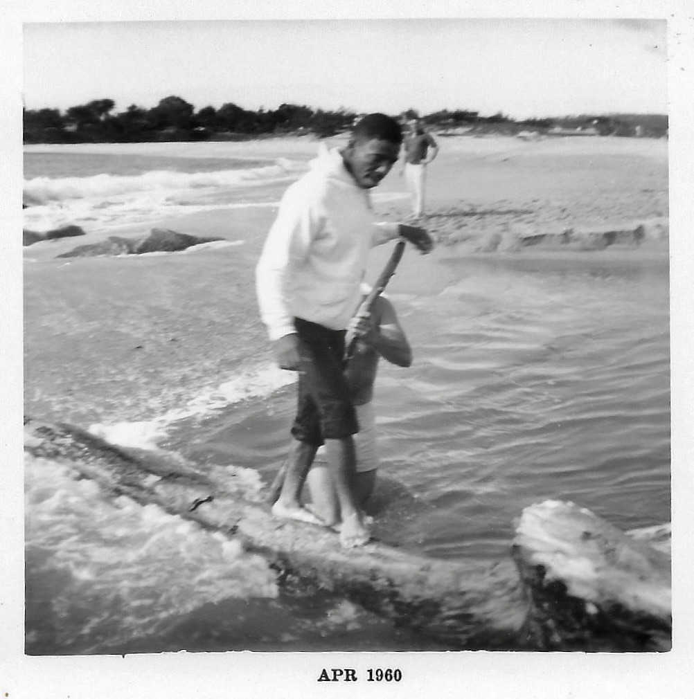 Wilbert in Monterrey, California walking across water on a log